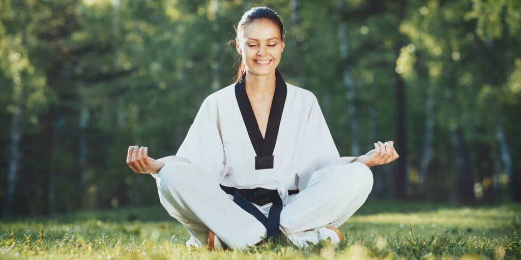 Martial Arts Lessons for Adults in Chandler AZ - Happy Woman Meditated Sitting Background