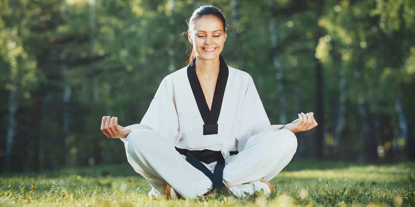 Martial Arts Lessons for Adults in Chandler AZ - Happy Woman Meditated Sitting Background